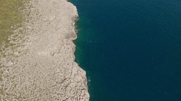 Aerial view of the rugged cliffs of Plemmirio Italy.