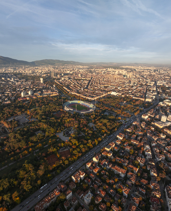 Aerial view of Vasil Levski National Stadium surrounded by lush parkland and the dense urban cityscape of Sofia Sofia City Province Bulgaria. Aerial view of Vasil Levski National Stadium surrounded by lush parkland and the dense urban cityscape of Sofia Sofia City Province Bulgaria.