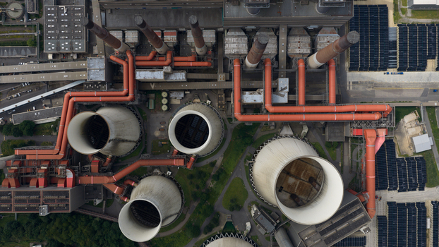 Aerial view of Kraftwerk Niederaussem showing large cooling towers complex industrial piping systems and plant infrastructure in Bergheim Nordrhein Westfalen Germany. Aerial view of Kraftwerk Niederaussem showing large cooling towers complex industrial piping systems and plant infrastructure in Bergheim Nordrhein Westfalen Germany.