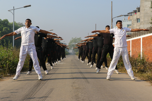 Dhaka Bangladesh 08 January 2017 View of Rapid Action Battalion personnel performing physical exercises and jumping jacks during a training session at the RAB Headquarters. Dhaka Bangladesh 08 January 2017 View of Rapid Action Battalion personnel performing physical exercises and jumping jacks during a training session at the RAB Headquarters.