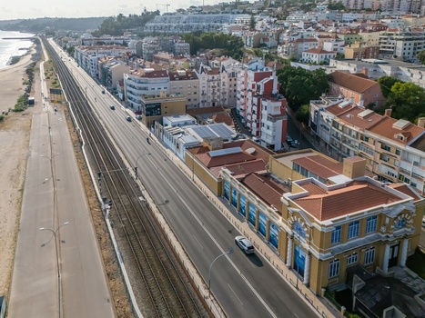 Cruz Quebrada Portugal 25 July 2026 Aerial view of the Vasco da Gama Aquarium along the coastal railway featuring historic architecture and surrounding urban buildings.