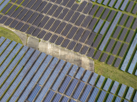 Aerial view of the former Military Airfield Preschen now a solar power plant with rows of panels covering the historic runway and taxiway in Neisse Malxetal Brandenburg Germany. Aerial view of the former Military Airfield Preschen now a solar power plant with rows of panels covering the historic runway and taxiway in Neisse Malxetal Brandenburg Germany.