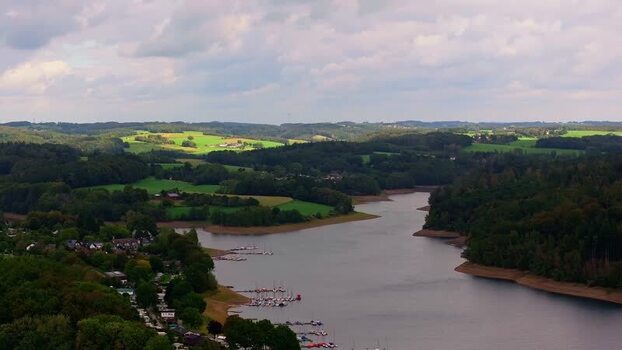 Aerial view of Bevertalsperre reservoir and surrounding hills Germany. Aerial view of Bevertalsperre reservoir and surrounding hills Germany.
