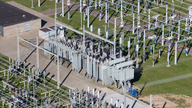 Aerial view of an electrical substation with transformers and high voltage power lines in Zwolle Overijssel Netherlands. Aerial view of an electrical substation with transformers and high voltage power lines in Zwolle Overijssel Netherlands.