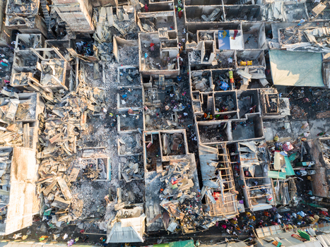 Aerial view of a desolate landscape with charred structures and debris where homes once stood a somber tableau of loss and destruction Dhaka Dhaka Division Bangladesh. Aerial view of a desolate landscape with charred structures and debris where homes once stood a somber tableau of loss and destruction Dhaka Dhaka Division Bangladesh.