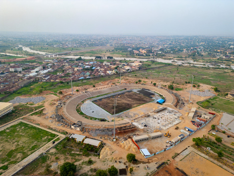 Kaduna Nigeria 13 May 2026 Aerial view of Ahmadu Bello Stadium under renovation with construction machinery surrounding residential areas and a river in the background. Kaduna Nigeria 13 May 2026 Aerial view of Ahmadu Bello Stadium under renovation with construction machinery surrounding residential areas and a river in the background.