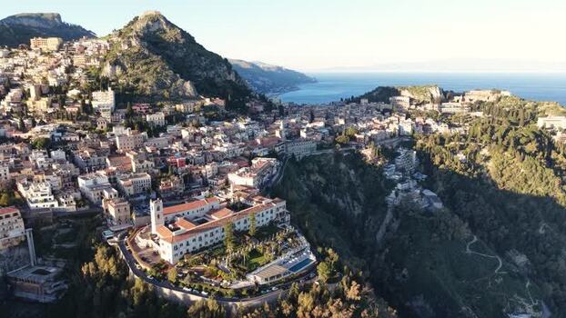 Aerial view of the historic hillside town of Taormina Italy.
