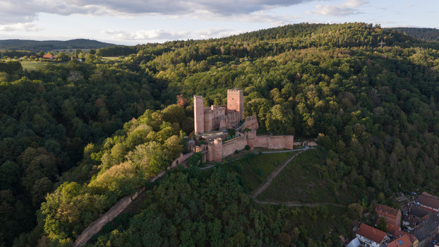 Aerial view of Henneburg castle ruins surrounded by dense forest and rolling hills in Stadtprozelten Bayern Germany. Aerial view of Henneburg castle ruins surrounded by dense forest and rolling hills in Stadtprozelten Bayern Germany.