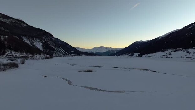 Aerial view of frozen Lake Reschen in Graun im Vinschgau Italy. Aerial view of frozen Lake Reschen in Graun im Vinschgau Italy.