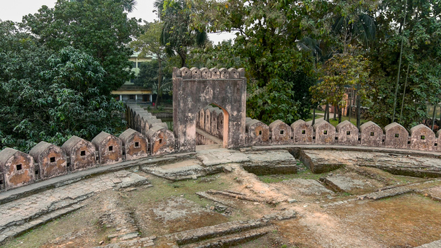 Aerial view of the majestic Idrakpur Fort s weathered walls and arched gateway stand amidst verdant trees Munshiganj Dhaka Division Bangladesh. Aerial view of the majestic Idrakpur Fort s weathered walls and arched gateway stand amidst verdant trees Munshiganj Dhaka Division Bangladesh.