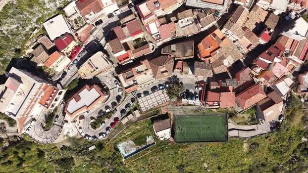 Aerial view of the hillside village of Castelmola Italy. Aerial view of the hillside village of Castelmola Italy.