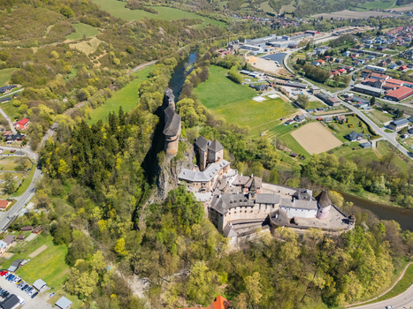 Aerial view of Orava Castle situated on a high rock cliff above the Orava river surrounded by lush green spring forests and the town of Dolny Kubin Zilinsky kraj Slovakia. Aerial view of Orava Castle situated on a high rock cliff above the Orava river surrounded by lush green spring forests and the town of Dolny Kubin Zilinsky kraj Slovakia.