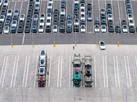 Aerial view of Tesla Gigafactory Berlin Brandenburg with car transport trucks loading electric vehicles in the parking lot in Grunheide Brandenburg Germany. Aerial view of Tesla Gigafactory Berlin Brandenburg with car transport trucks loading electric vehicles in the parking lot in Grunheide Brandenburg Germany.