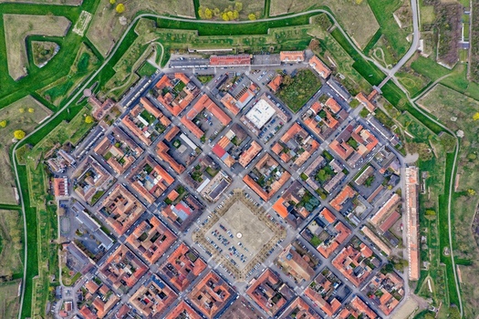 Aerial view of the star shaped fortress with its intricate network of moats and ramparts a testament to military architecture Neuf Brisach Grand Est France.