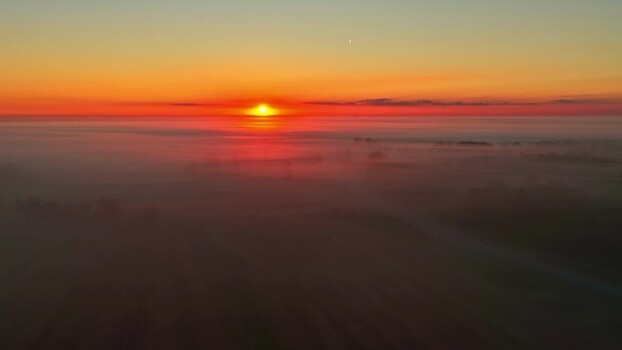Aerial view of sunrise over foggy landscape Latvia. Aerial view of sunrise over foggy landscape Latvia.