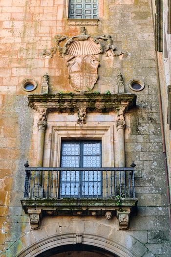 Plasencia Spain 03 December 2025 View of an ornate stone balcony and heraldic coat of arms on a historic building facade in the walled city. Plasencia Spain 03 December 2025 View of an ornate stone balcony and heraldic coat of arms on a historic building facade in the walled city.