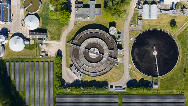 Aerial view of RWZI Echten wastewater treatment plant featuring circular sedimentation tanks and solar panel arrays in Hoogeveen Drenthe Netherlands. Aerial view of RWZI Echten wastewater treatment plant featuring circular sedimentation tanks and solar panel arrays in Hoogeveen Drenthe Netherlands.