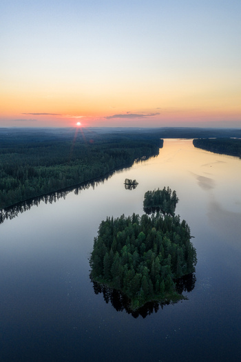 Aerial view of Laaminki lake with forested islands at sunset Kangasniemi Etela Savo Finland. Aerial view of Laaminki lake with forested islands at sunset Kangasniemi Etela Savo Finland.