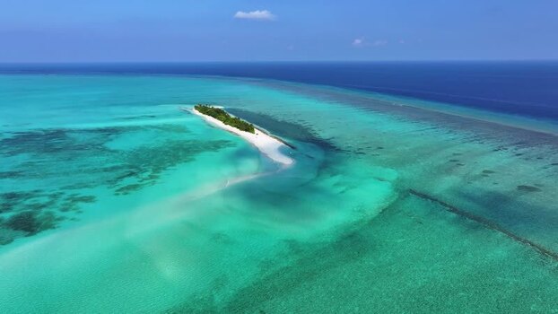 Aerial view of a tropical island and coral reefs Maldives.