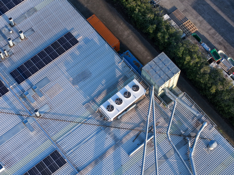 Melbourne VIC Australia 22 September 2026 Aerial view of industrial factory rooftops in Kilsyth featuring solar panels HVAC units and metal corrugated roofing. Melbourne VIC Australia 22 September 2026 Aerial view of industrial factory rooftops in Kilsyth featuring solar panels HVAC units and metal corrugated roofing.