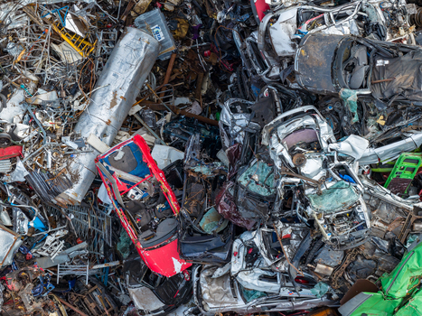 Aerial view of scrapped cars and crushed metal debris piled in a junkyard and recycling site in Hoogeveen Drenthe Netherlands. Aerial view of scrapped cars and crushed metal debris piled in a junkyard and recycling site in Hoogeveen Drenthe Netherlands.