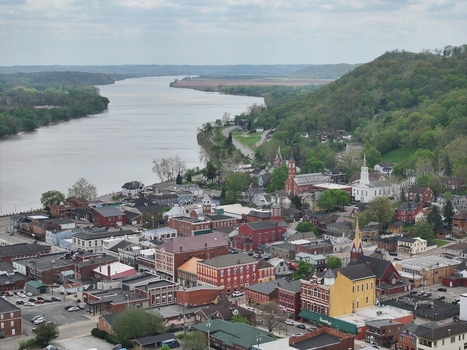 Aerial view of the historic town center with brick buildings and church steeples along the winding Ohio River Aurora Indiana United States. Aerial view of the historic town center with brick buildings and church steeples along the winding Ohio River Aurora Indiana United States.