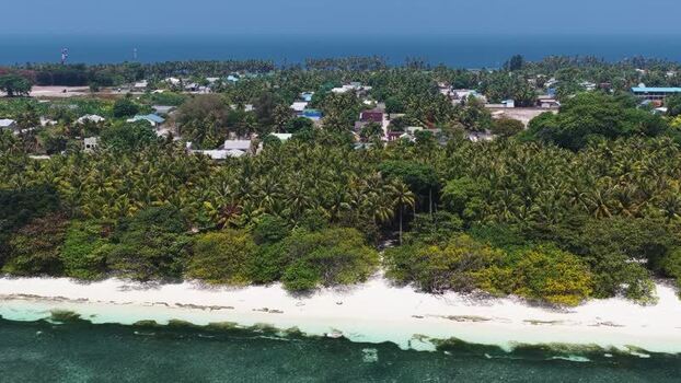 Aerial view of Vaikaradhoo island in the Maldives. Aerial view of Vaikaradhoo island in the Maldives.