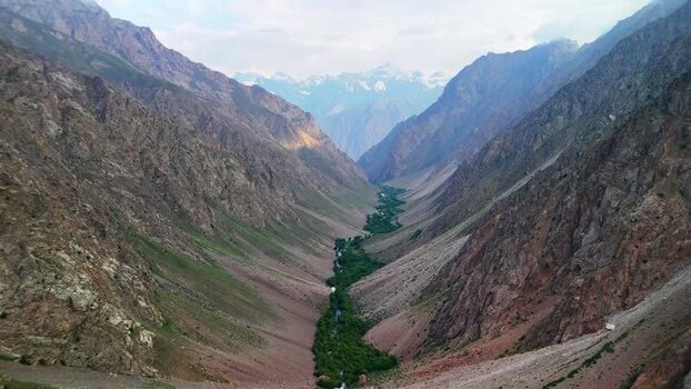 Aerial view of Qullai Vudor peak and mountain valley Tajikistan.