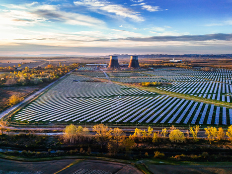 Trino Italy 30 March 2026 Aerial view of the expansive solar farm its panels gleaming under the sky juxtaposed against the massive cooling towers. Trino Italy 30 March 2026 Aerial view of the expansive solar farm its panels gleaming under the sky juxtaposed against the massive cooling towers.