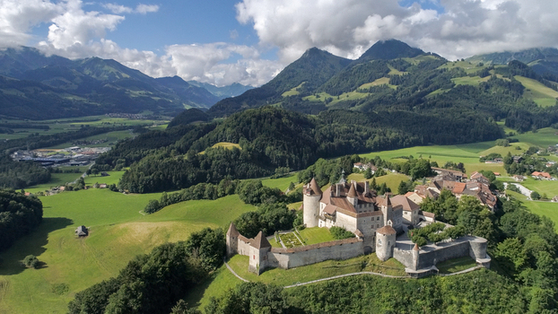 Gruyeres Switzerland 14 May 2026 Aerial view of Gruyeres Castle on a hilltop with its medieval towers stone walls and the surrounding Swiss Alps under a dramatic sky. Gruyeres Switzerland 14 May 2026 Aerial view of Gruyeres Castle on a hilltop with its medieval towers stone walls and the surrounding Swiss Alps under a dramatic sky.