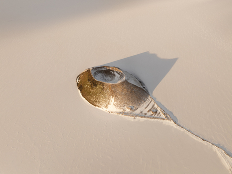 Aerial view of Myvatn volcanic crater covered in snow with long shadows cast across the frozen landscape Thingeyjarsveit Iceland. Aerial view of Myvatn volcanic crater covered in snow with long shadows cast across the frozen landscape Thingeyjarsveit Iceland.