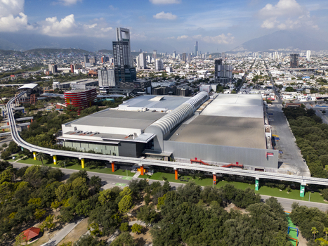 Aerial view of Fundidora Park featuring the CINTERMEX convention center modern skyscrapers and the elevated monorail track in Monterrey Nuevo Leon Mexico. Aerial view of Fundidora Park featuring the CINTERMEX convention center modern skyscrapers and the elevated monorail track in Monterrey Nuevo Leon Mexico.