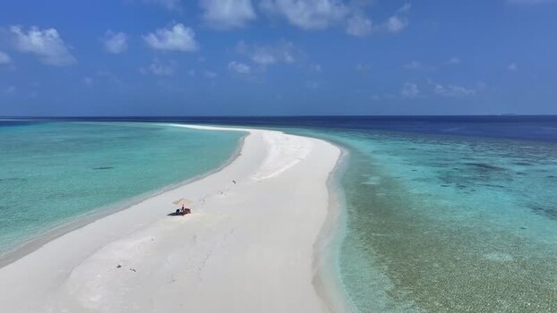 Aerial view of a white sandbar and turquoise ocean in Maldives. Aerial view of a white sandbar and turquoise ocean in Maldives.