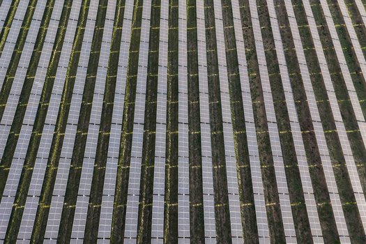 Aerial view of rows of solar panels installed in a field in Woodburn Oregon United States. Aerial view of rows of solar panels installed in a field in Woodburn Oregon United States.
