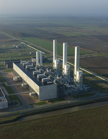 Aerial view of the nitrogen plant with tall white stacks and industrial buildings surrounded by green fields in Zuidbroek Groningen Netherlands. Aerial view of the nitrogen plant with tall white stacks and industrial buildings surrounded by green fields in Zuidbroek Groningen Netherlands.