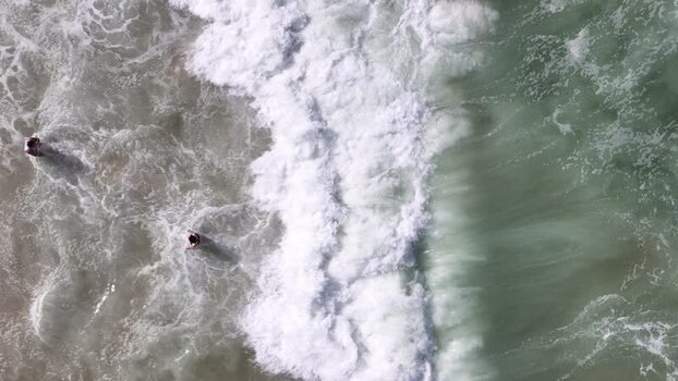 Aerial view of waves crashing at Copacabana Beach Brazil.