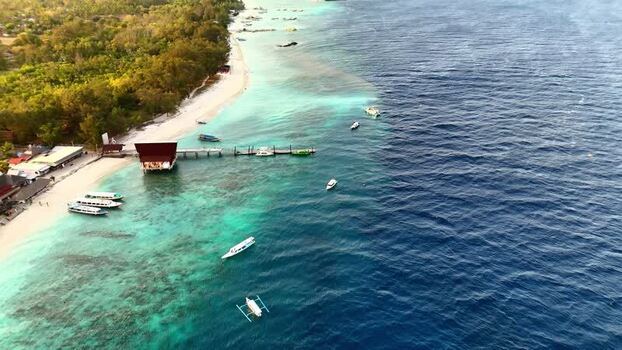 Aerial view of Gili Air coastline with turquoise water Indonesia.