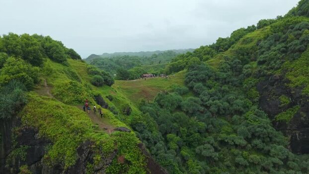 Aerial view of hikers on Bukit Pengilon hills Indonesia.
