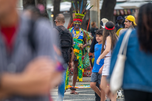 Rio de Janeiro Brazil 13 June 2026 View of an indigenous man in traditional feathered headdress and face paint standing among a crowd during the World Cup 2026.