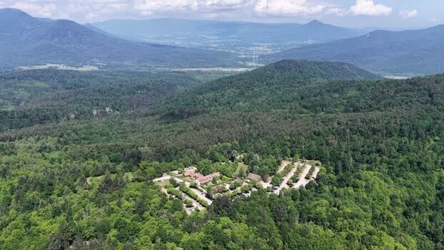 Aerial view of a forest complex and rolling hills in Selestat France.