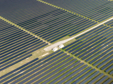 Aerial view of the solar farm at the former Preschen military airfield with rows of photovoltaic panels covering historic runway infrastructure in Neisse Malxetal Brandenburg Germany. Aerial view of the solar farm at the former Preschen military airfield with rows of photovoltaic panels covering historic runway infrastructure in Neisse Malxetal Brandenburg Germany.