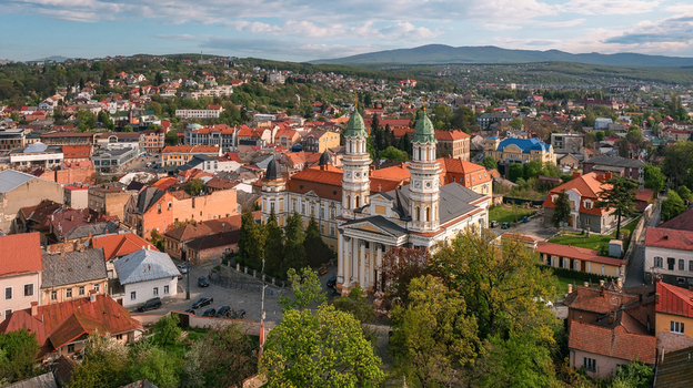 Aerial view of the majestic Uzhhorod Cathedral gleams in the sunlight its twin towers piercing the skyline above the city s russet rooftops Uzhhorod Zakarpattia Oblast Ukraine. Aerial view of the majestic Uzhhorod Cathedral gleams in the sunlight its twin towers piercing the skyline above the city s russet rooftops Uzhhorod Zakarpattia Oblast Ukraine.