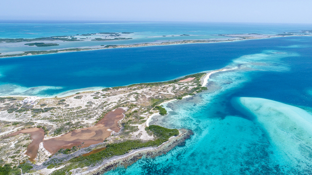 Aerial view of Los Roques archipelago with turquoise waters coral reefs and sandy islands Los Roques Dependencias Federales Venezuela. Aerial view of Los Roques archipelago with turquoise waters coral reefs and sandy islands Los Roques Dependencias Federales Venezuela.