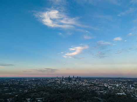 Aerial view of the Brisbane skyline just before sunrise with soft morning light illuminating the city buildings and surrounding urban landscape in Brisbane Queensland Australia. Aerial view of the Brisbane skyline just before sunrise with soft morning light illuminating the city buildings and surrounding urban landscape in Brisbane Queensland Australia.