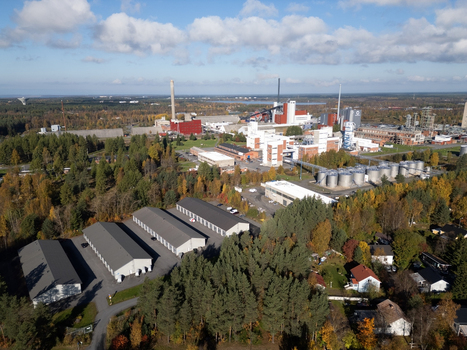 Oulu Finland 25 September 2026 Aerial view of Takalaanila industrial area with factory buildings storage tanks and surrounding forest in autumn colors under a blue sky. Oulu Finland 25 September 2026 Aerial view of Takalaanila industrial area with factory buildings storage tanks and surrounding forest in autumn colors under a blue sky.