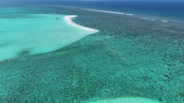 Aerial view of a white sandbank and coral reefs in the ocean Maldives. Aerial view of a white sandbank and coral reefs in the ocean Maldives.