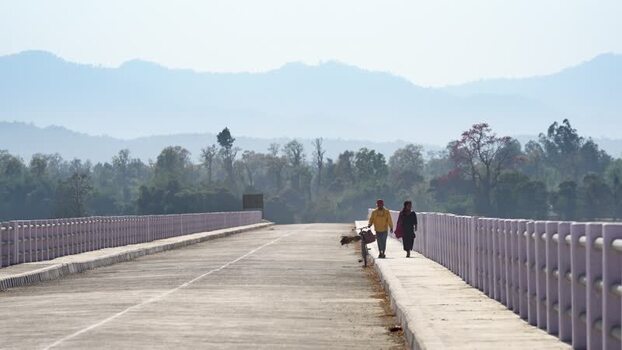 View of people walking on a bridge in Dhangadhi Nepal. View of people walking on a bridge in Dhangadhi Nepal.