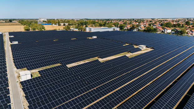 Aerial view of a large solar farm with rows of photovoltaic panels in the rural landscape of Temerin Vojvodina Serbia. Aerial view of a large solar farm with rows of photovoltaic panels in the rural landscape of Temerin Vojvodina Serbia.