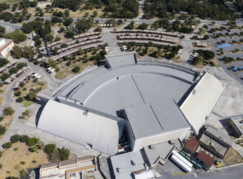 Aerial view of the Auditorio Fundidora amphitheater surrounded by lush parkland parking areas and trees in Monterrey Nuevo Leon Mexico. Aerial view of the Auditorio Fundidora amphitheater surrounded by lush parkland parking areas and trees in Monterrey Nuevo Leon Mexico.