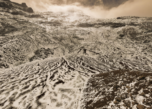 Aerial view of the snow covered slopes and rocky terrain of Volcano Chimborazo in Guano Chimborazo Ecuador. Aerial view of the snow covered slopes and rocky terrain of Volcano Chimborazo in Guano Chimborazo Ecuador.